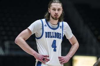 FILE - North Carolina Asheville forward Drew Pember (4) looks on during the Big South Championship NCAA college basketball game against Campbell, Sunday, March 5, 2023, in Charlotte, N.C. Weber State’s Dillon Jones and UNC Asheville’s Drew Pember had every reason to decide they’d done enough at this level. Yet both returned to school in part because they wanted their college careers to have a better finish. (AP Photo/Jacob Kupferman, File)