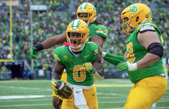 Oregon running back Bucky Irving (0) celebrates after his touchdown against Washington State with offensive lineman Jackson Powers-Johnson, right, and offensive lineman Steven Jones, back, during the first half of an NCAA college football game Saturday, Oct. 21, 2023, in Eugene, Ore. (AP Photo/Andy Nelson)