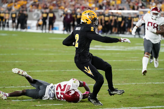 Arizona State wide receiver Elijhah Badger (2) scores a touchdown as he gets past Washington State defensive back Javan Robinson (23) during the second half of an NCAA college football game Saturday, Oct. 28, 2023, in Tempe, Ariz. (AP Photo/Ross D. Franklin)