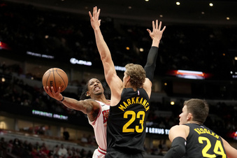Chicago Bulls' DeMar DeRozan shoots around Utah Jazz's Lauri Markkanen as Walker Kessler watches during the first half of an NBA basketball game Monday, Nov. 6, 2023, in Chicago. (AP Photo/Charles Rex Arbogast)