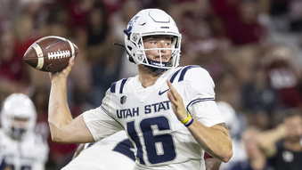 FILE - Utah State quarterback Levi Williams (16) plays during the second half of an NCAA college football game, Saturday, Sept. 3, 2022, in Tuscaloosa, Ala. Utah State quarterback Levi Williams will not return for his senior season in 2024, intending to apply for Navy SEAL training following the Aggies’ upcoming bowl game. Williams revealed in a radio interview with a Salt Lake City radio station on Monday, Nov. 27, 2023, he intends to forgo his final year of collegiate eligibility with the goal of becoming a SEAL officer in 2025.(AP Photo/Vasha Hunt, File)