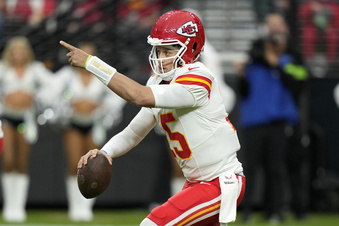 Kansas City Chiefs quarterback Patrick Mahomes signals toward teammates during the first half of an NFL football game against the Las Vegas Raiders, Sunday, Nov. 26, 2023, in Las Vegas. (AP Photo/John Locher)