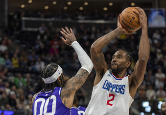 Los Angeles Clippers forward Kawhi Leonard (2) shoots over Utah Jazz guard Jordan Clarkson (00), during the second half of an NBA basketball game Friday, Dec. 8, 2023, in Salt Lake City. (AP Photo/Rick Egan)