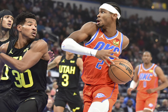 Oklahoma City Thunder guard Shai Gilgeous-Alexander (2) drives past Utah Jazz guard Ochai Agbaji (30) in the first half of an NBA basketball game, Monday, Dec. 11, 2023, in Oklahoma City. (AP Photo/Kyle Phillips)