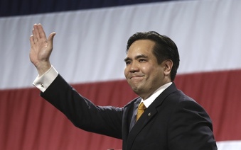 FILE - In this April 25, 2014, file photo, Utah's Attorney General Sean Reyes waves during a rally at the Western Republican Leadership Conference in Sandy, Utah. Utah Attorney General Sean Reyes announced Friday, Dec. 8, 2023 he will not seek reelection in 2024 amid scrutiny for his decadelong friendship with the embattled founder of an anti-child-trafficking group and as bipartisan state lawmakers have cast doubt on his administrative practices..(AP Photo/Rick Bowmer, File)