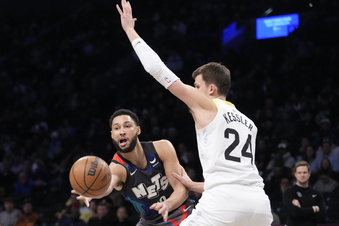Brooklyn Nets guard Ben Simmons, left, moves the ball around Utah Jazz center Walker Kessler (24) during the first half of an NBA basketball game, Monday, Jan. 29, 2024, in New York. (AP Photo/Mary Altaffer)