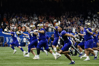 Washington players celebrate victory against Texas after the Sugar Bowl CFP NCAA semifinal college football game between Washington and Texas, Monday, Jan. 1, 2024, in New Orleans. Washington won 37-31. (AP Photo/Jacob Kupferman)