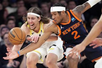 Utah Jazz forward Kelly Olynyk and New York Knicks guard Miles McBride (2) chase a loose ball during the second half of an NBA basketball game, Tuesday, Jan. 30, 2024, at Madison Square Garden in New York. The Knicks won 118-103. (AP Photo/Mary Altaffer)