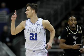 BYU guard Trevin Knell celebrates after making a basket during the first half of an NCAA college basketball game against UCF Wednesday, March 13, 2024, in Kansas City, Mo. (AP Photo/Charlie Riedel)