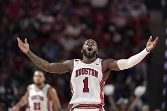 Houston's Jamal Shead encourages the crowd during the second half of an NCAA college basketball game against Kansas Saturday, March 9, 2024, in Houston. Houston won 76-46 and finished the regular season as the Big 12 Conference Champions. (AP Photo/David J. Phillip)