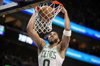 Boston Celtics forward Jayson Tatum dunks the ball during the first half of an NBA basketball game against the Utah Jazz, Tuesday, March 12, 2024, in Salt Lake City. (AP Photo/George Frey)