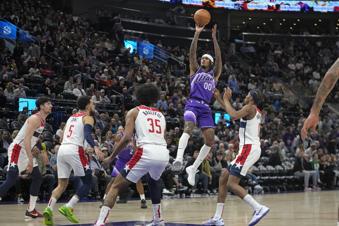 Utah Jazz guard Jordan Clarkson (00) shoots against the Washington Wizards during the second half of an NBA basketball game, Monday, March 4, 2024, in Salt Lake City. (AP Photo/Rick Bowmer)