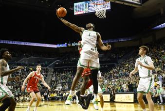 Oregon center N'Faly Dante (1) pulls down a rebound against Utah during the second half of an NCAA college basketball game in Eugene, Ore., Saturday, March 9, 2024. Oregon beat Utah 66-65. (AP Photo/Thomas Boyd)
