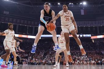 BYU guard Kailey Woolston (10) and Texas forward Madison Booker (35) reach for a rebound during the first half of an NCAA college basketball game in Austin, Texas, Saturday, March 2, 2024. (AP Photo/Eric Gay)