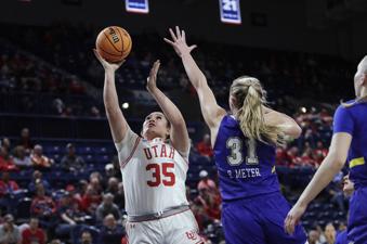 Utah forward Alissa Pili (35) shoots against South Dakota State forward Brooklyn Meyer (31) during the second half of a first-round college basketball game in the women's NCAA Tournament in Spokane, Wash., Saturday, March 23, 2024. (AP Photo/Young Kwak)