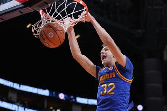 FILE - East forward Cooper Flagg dunks on a fast break during the third quarter of the McDonald's All American boys' basketball game Tuesday, April 2, 2024, in Houston. The incoming Duke freshman is among the potential headliners for the 2025 NBA draft.(AP Photo/Kevin M. Cox)