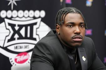 Kansas quarterback Jalon Daniels answers questions from the media during Big 12 NCAA college football media days in Las Vegas, Wednesday, July 10, 2024. (AP Photo/Lucas Peltier)