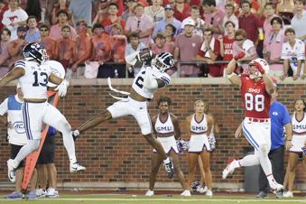 BYU cornerback Marque Collins (2) intercepts a pass intended for SMU tight end Matthew Hibner (88) during the second half of an NCAA college football game Friday, Sept. 6, 2024, in Dallas. (Smiley N. Pool/The Dallas Morning News via AP)
