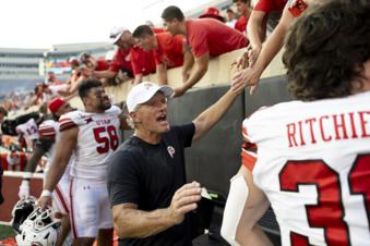Utah head coach Kyle Whittingham celebrates with players and fans after an NCAA college football game against Oklahoma State, Saturday, Sept. 21, 2024, in Stillwater, Okla. (AP Photo/Mitch Alcala)