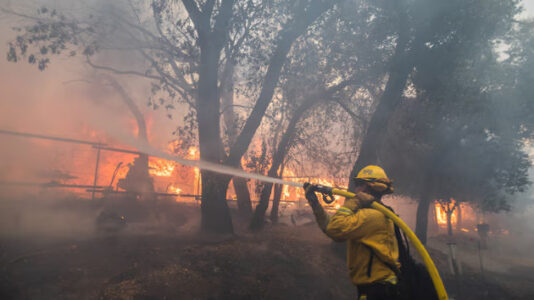 California Line wildfire suspect arrested as 65,600 structures threatened