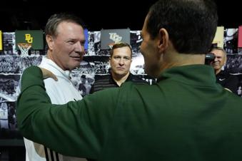 Kansas head coach Bill Self, left, talks with Iowa State head coach T.J. Otzelberger, center, and Baylor head coach Scott Drew during the NCAA college Big 12 men's basketball media day, Wednesday, Oct. 23, 2024, in Kansas City, Mo. (AP Photo/Charlie Riedel)