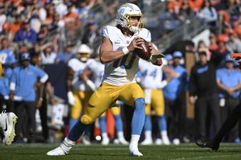 Los Angeles Chargers quarterback Justin Herbert (10) looks to pass during the first half of an NFL football game against the Denver Broncos, Sunday, Oct. 13, 2024, in Denver. (AP Photo/Geneva Heffernan)