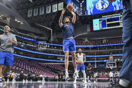 Dallas Mavericks center Dereck Lively II, center front, warms up before an NBA basketball game against the Utah Jazz, Monday, Oct. 28, 2024, in Dallas. (AP Photo/Albert Pena)