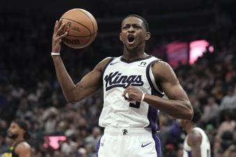 Sacramento Kings guard De'Aaron Fox (5) reacts to a call during the first half of an NBA basketball game against the Utah Jazz, Tuesday, Oct. 29, 2024, in Salt Lake City. (AP Photo/Bethany Baker)