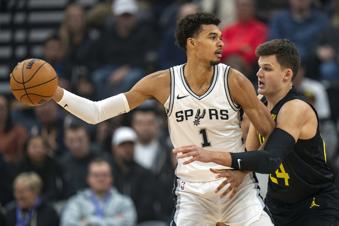 San Antonio Spurs center Victor Wembanyama (1) looks for an outlet as Utah Jazz center Walker Kessler (24) defends during the first half of an NBA basketball game, Thursday, Oct. 31, 2024, in Salt Lake City. (AP Photo/Rick Egan)