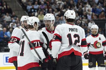 Ottawa Senators celebrate after forward Ridly Greig (71) scores against the Utah Hockey Club in the first period of an NHL hockey game, Tuesday Oct 22, 2024, in Salt Lake City. (AP Photo/Melissa Majchrzak)