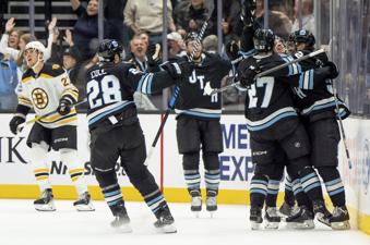 Utah Hockey Club celebrates a goal during the third period of an NHL hockey game against the Boston Bruins, Saturday, Oct. 19, 2024, in Salt Lake City. (AP Photo/Spenser Heaps)