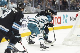 San Jose Sharks right wing Barclay Goodrow (23) fights for the puck against Utah Hockey Club left wing Matias Maccelli, right, during the second period of an NHL hockey game, Monday, Oct 28, 2024, in Salt Lake City. (AP Photo/Melissa Majchrzak)