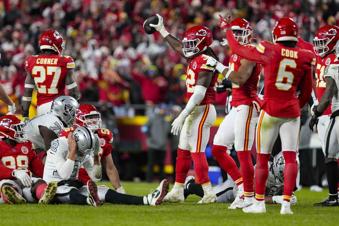 Kansas City Chiefs linebacker Nick Bolton (32) holds the recovery ball after a fumble by the Las Vegas Raiders during the second half of an NFL football game in Kansas City, Mo., Friday, Nov. 29, 2024. (AP Photo/Ed Zurga)