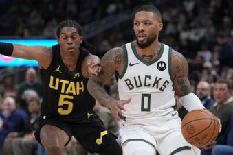 Utah Jazz's Taylor Hendricks gets past Utah Jazz's Cody Williams during the first half of an NBA basketball game Thursday, Nov. 7, 2024, in Milwaukee. (AP Photo/Morry Gash)