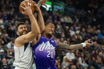 Dallas Mavericks forward Maxi Kleber, left, gets tangled up with Utah Jazz forward John Collins (20) during the first half of an NBA basketball game Thursday, Nov. 14, 2024, in Salt Lake City. (AP Photo/Rick Egan)
