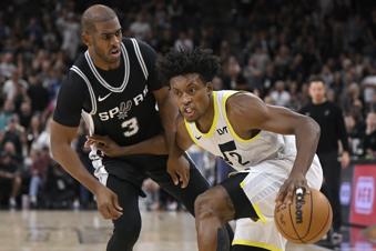 Utah Jazz's Collin Sexton (2) drives against San Antonio Spurs' Chris Paul during the second half of an NBA basketball game, Saturday, Nov. 9, 2024, in San Antonio. Utah won 111-110. (AP Photo/Darren Abate)
