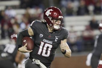Washington State quarterback John Mateer (10) carries the ball during the first half of an NCAA college football game against Utah State, Saturday, Nov. 9, 2024, in Pullman, Wash. (AP Photo/Young Kwak)