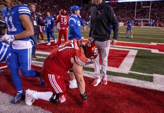 Utah defensive tackle Keanu Tanuvasa reacts after losing to BYU in an NCAA college football game, just after midnight on Sunday, Nov. 10, 2024, in Salt Lake City. (AP Photo/Spenser Heaps)