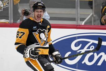 Pittsburgh Penguins' Sidney Crosby (87) celebrates after getting his 600th career goal in the NHL during the second period of an NHL hockey game against the Utah Hockey Club, Saturday, Nov. 23, 2024, in Pittsburgh. (AP Photo/Gene J. Puskar)