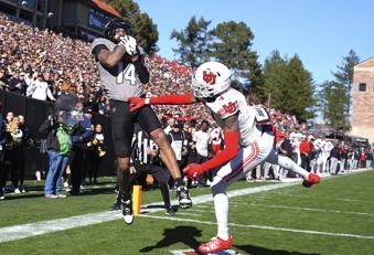 Colorado wide receiver Will Sheppard, left, pulls in a touchdown pass over Utah cornerback Cameron Calhoun in the first half of an NCAA college football game Saturday, Nov. 16, 2024, in Boulder, Colo. (AP Photo/David Zalubowski)