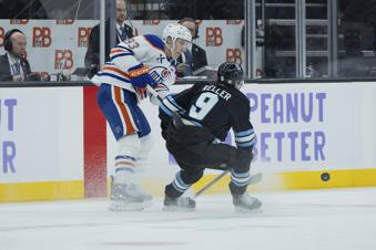 Edmonton Oilers center Ryan Nugent-Hopkins (93) passes the puck against Utah Hockey Club center Clayton Keller (9) during the second period of an NHL hockey game, Friday, Nov. 29, 2024, in Salt Lake City. (AP Photo/Melissa Majchrzak)