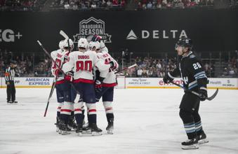 The Washington Capitals celebrate a goal as Utah Hockey Club defenseman Ian Cole (28) reacts during the second period of an NHL hockey game Monday, Nov. 18, 2024, in Salt Lake City. (AP Photo/Bethany Baker)
