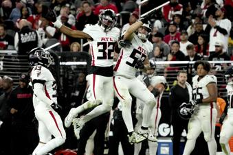 Atlanta Falcons cornerback Kevin King (32) and linebacker Nate Landman (53) celebrate a blocked point after attempt against the Las Vegas Raiders during the second half of an NFL football game, Monday, Dec. 16, 2024, in Las Vegas. (AP Photo/Rick Scuteri)