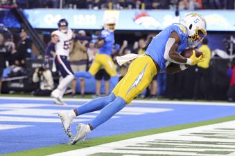 Los Angeles Chargers wide receiver Joshua Palmer (5) catches the ball in the end zone for a two-point conversion during the second half an NFL football game against the Denver Broncos, Thursday, Dec. 19, 2024, in Inglewood, Calif. (AP Photo/Ryan Sun)