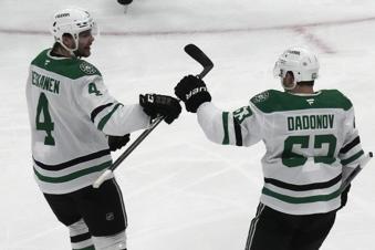 Dallas Stars right wing Evgenii Dadonov (63) celebrates with teammate Miro Heiskanen (4) after scoring against the Utah Hockey Club during the second period of an NHL hockey game Monday, Dec. 2, 2024, in Salt Lake City. (AP Photo/Rick Bowmer)