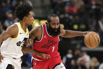 Los Angeles Clippers guard James Harden (1) drives the ball against Utah Jazz guard Collin Sexton (2) during the first half of an NBA basketball game Monday, Dec. 16, 2024, in Inglewood, Calif. (AP Photo/William Liang)