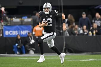Las Vegas Raiders quarterback Aidan O'Connell runs with the ball against the Jacksonville Jaguars during the first half of an NFL football game Sunday, Dec. 22, 2024, in Las Vegas. (AP Photo/David Becker)