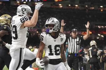 Las Vegas Raiders wide receiver Jakobi Meyers (16) celebrates with teammate tight end Brock Bowers (89) after catching a 3-yard touchdown pass during the first half of an NFL football game against the New Orleans Saints, Friday, Nov. 29, 2024, in New Orleans. (AP Photo/Gerald Herbert)