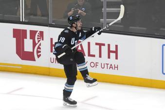 Utah Hockey Club defenseman Mikhail Sergachev (98) reacts after scoring against the Vancouver Canucks during overtime of an NHL hockey game Wednesday, Dec. 18, 2024, in Salt Lake City. (AP Photo/Rick Bowmer)