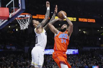 Oklahoma City Thunder forward Kenrich Williams (34) prepares to shoot against Utah Jazz forward John Collins, left, during the first half of an Emirates NBA Cup basketball game, Tuesday, Dec. 3, 2024, in Oklahoma City. (AP Photo/Nate Billings)